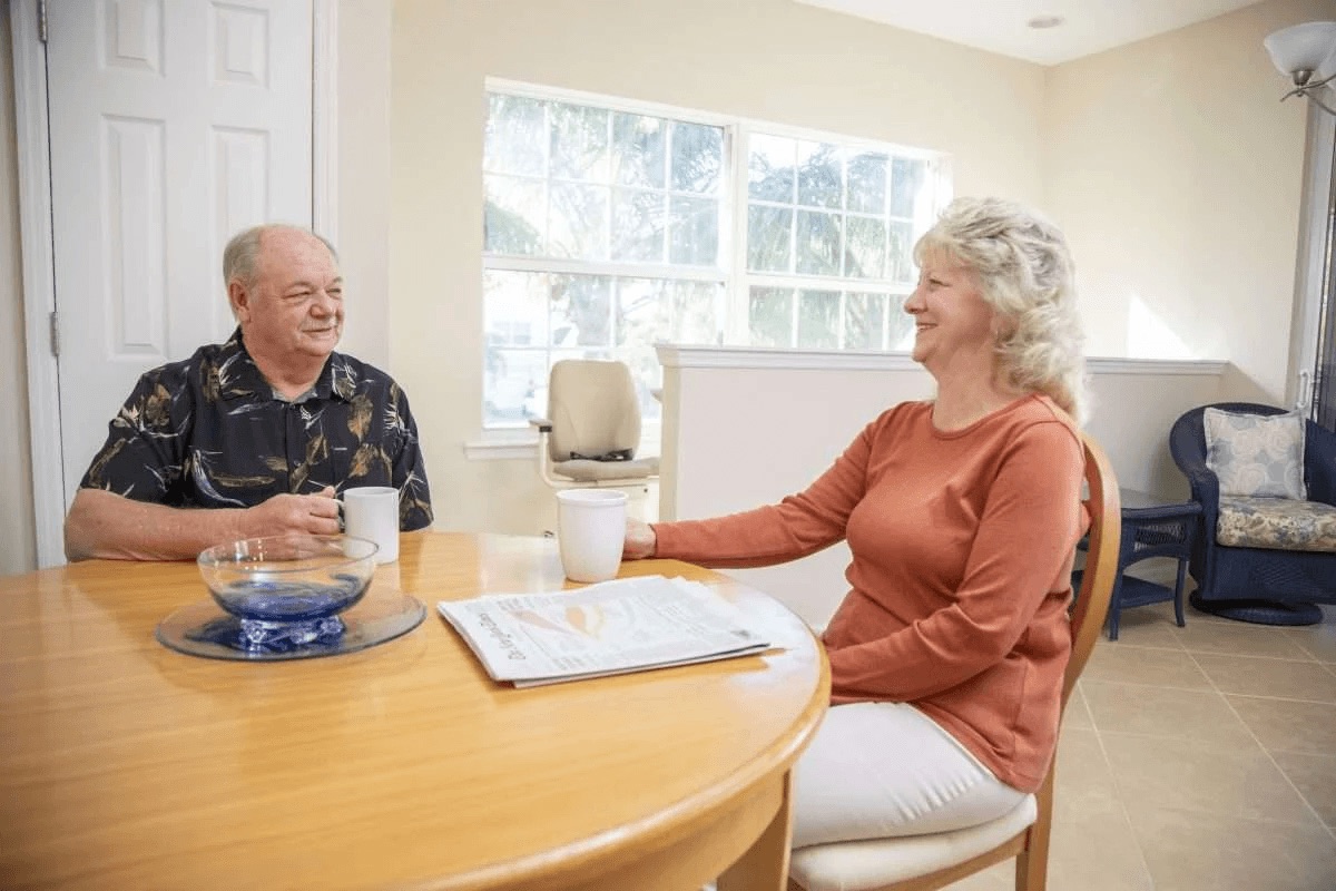 Couple reviewing stairlift options during an in-home consultation