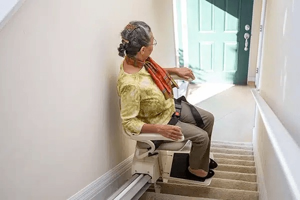 Straight stairlift seat on a residential staircase